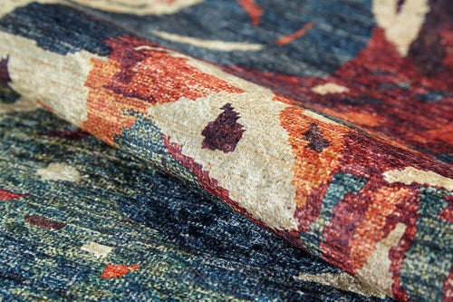 Load image 1 in gallery view. A close-up of the Psychedelic Splash - Machine-Washable Rug (JR5096) shows its plush, woven texture and colorful abstract patterns in blue, red, orange, and beige—ideal for allergy-sensitive or high-traffic areas.