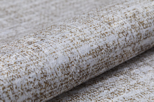 Load image 1 in gallery view. A close-up of Pure Bliss - Washable Rug - JR745 (Outlet) US shows a textured weave with light gray and brown speckles. The soft, washable material is slightly reflective, making it ideal for high-traffic areas and stylish interiors.