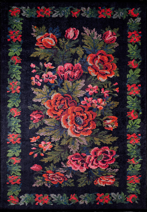 Load image 1 in gallery view. The Radiant Bloom - Washable Rug - JR294 features a black background with bold red, pink, and orange floral patterns, green leaves, and a red-green floral border—perfect for high-traffic areas.