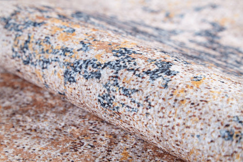 Load image 1 in gallery view. A close-up of the Rhythmic Ripples - Washable Rug (JR1637) reveals a speckled flat weave in beige, brown, orange, and dark gray tones, showcasing its intricate design and durable fibers—ideal for stylish, washable home decor.