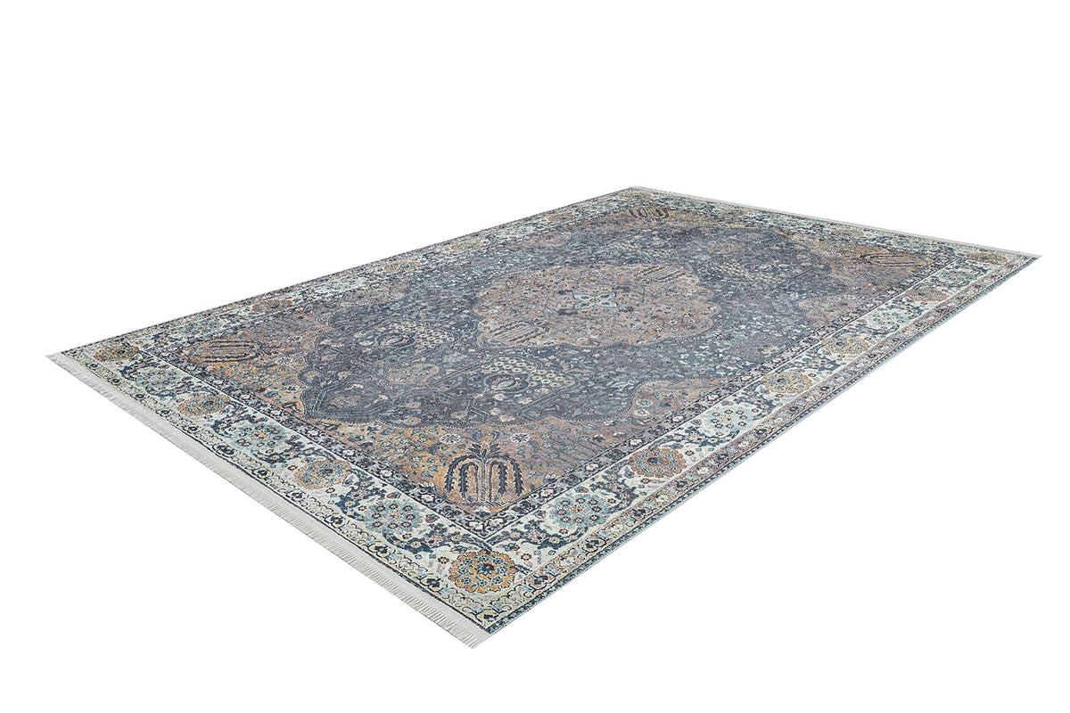 The Royal Sultan - Washable Rug - JR1970 is a large blue rectangular Persian-style rug with intricate floral and geometric patterns in muted blue, gray, and beige tones, ideal for allergy-sensitive homes. Shown on a white background.