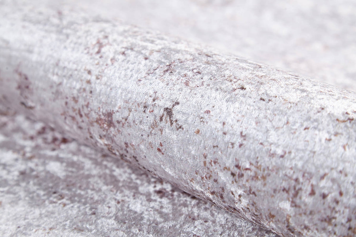 A close-up of silver crushed velvet fabric with a soft, textured shine—an ideal accent for the Rustic Trails - Washable Rug - JR1736 in high-traffic areas.