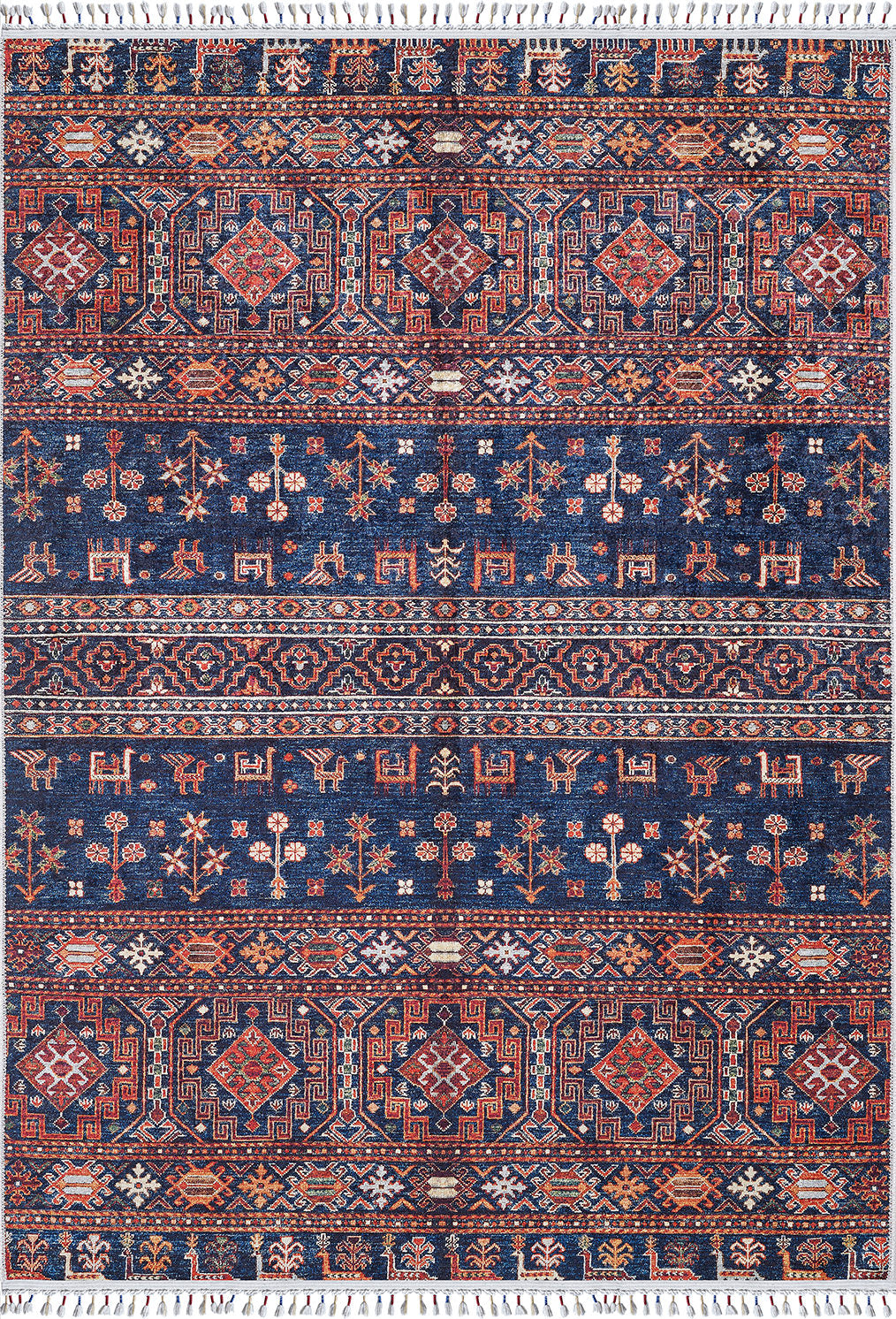 The Sahara Sunrise - Washable Rug - JR5091 is a rectangular washable rug with geometric, floral, and animal motifs in blue, red, white, and orange. It’s ideal for high-traffic areas and features horizontal rows with tassels at each end.