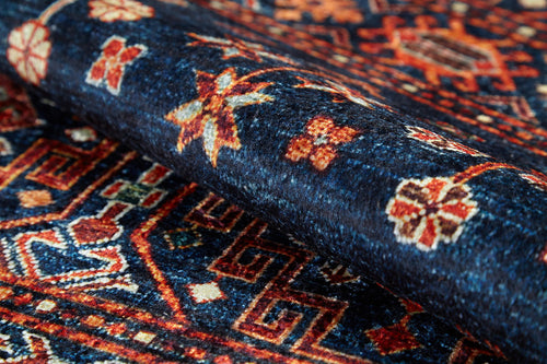 Bild 1 in Galerieansicht laden. A close-up of the Sahara Sunrise - Washable Rug - JR5091 shows intricate geometric and floral patterns in blue, red, orange, and cream. Its detailed weave is clearly visible, making it perfect for allergy-sensitive or high-traffic areas.
