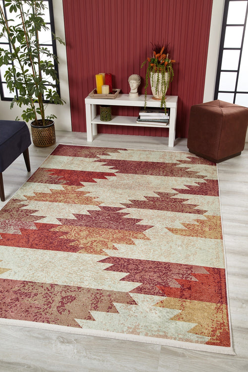Bild 1 in Galerieansicht laden. A room featuring the Simplistic Artistry - Washable Rug - JR1647 with a red geometric pattern, white console table, red accent wall, green potted plant, brown ottoman, and black-trimmed window—ideal for high-traffic areas.