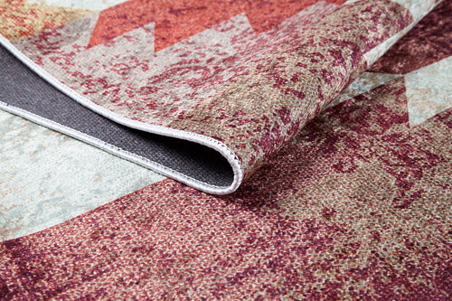 Bild 1 in Galerieansicht laden. A close-up of the Simplistic Artistry - Washable Rug - JR1647 in red, featuring maroon and beige geometric textured designs with a lifted corner showing its washable, non-slip backing—perfect for high-traffic areas.
