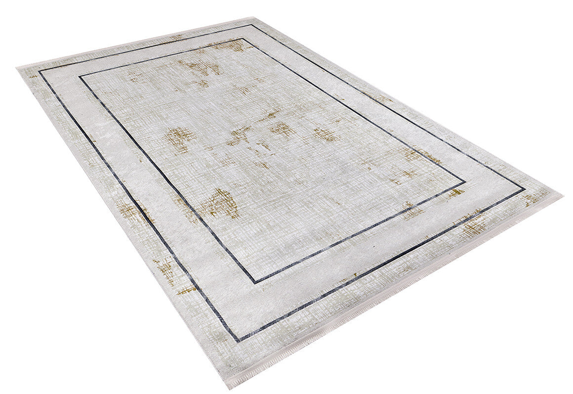The "Sleek and Contemporary - Washable Rug - JR1365" features a light beige background, subtle gold distressing, and two thin black rectangular borders—ideal for allergy-sensitive homes and easy to clean.
