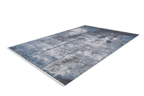 Load image 1 in gallery view. The Solar Eclipse - Washable Rug - JR1921 features a rectangular, distressed abstract design in blue, gray, and white. Ideal for high-traffic areas, it’s shown laid flat against a white background.