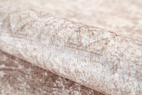 Load image 1 in gallery view. A close-up of the Sunset Fade - Washable Rug - JR1878, featuring a subtle abstract beige and light brown pattern—an ideal complement to cream rugs for high-traffic areas.