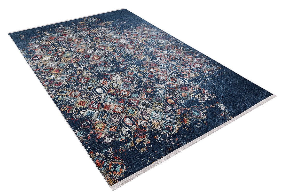 The Tarnished Elegance - Washable Rug - JR1095 is a rectangular blue rug with a dark blue base, featuring intricate multicolored floral and geometric patterns. Ideal for high-traffic areas, it's easy to clean and is displayed on a white background.
