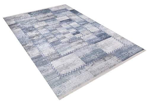 Load image 1 in gallery view. The Tartan Twist - Washable Rug - JR31 features a geometric patchwork design in blue, gray, and white tones with a textured look and rectangular patterns within a bordered frame. Ideal for allergy-sensitive homes. Shown on a white background.
