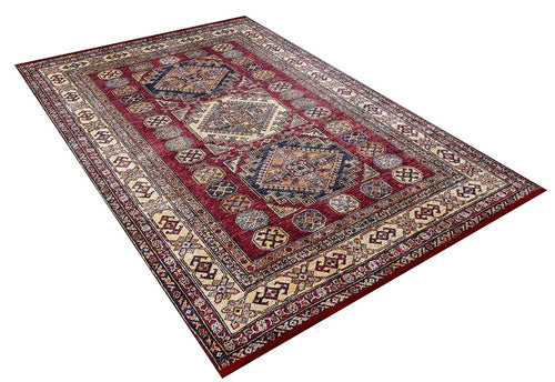 Load image 1 in gallery view. The Time-Honored Textures - Washable Rug - JR40 is a large, rectangular red Persian-style rug featuring intricate geometric patterns and ornate cream, blue, and brown borders—ideal for high-traffic areas and shown on a white background.