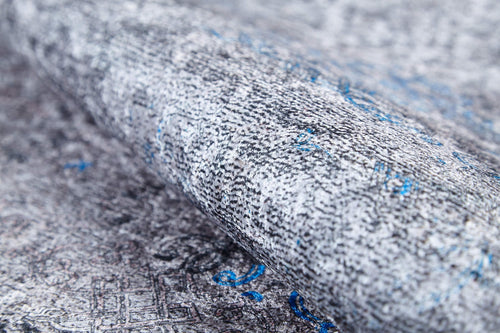 Load image 1 in gallery view. Close-up of the Timeless Embellishment - Washable Rug - JR1943: a textured flat weave in gray and white with blue accents. Its detailed, woven design adds modern flair while being an allergy-friendly, washable rug option.