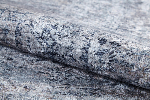 Load image 1 in gallery view. A close-up of the Timeless Scrollwork - Washable Rug - JR1774, featuring a gray-anthracite, stone-like pattern on a matching surface—ideal for high-traffic areas and achieving a seamless natural stone look.