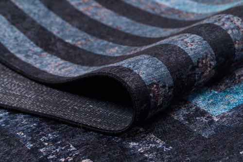 Bild 1 in Galerieansicht laden. Close-up of the Traditional and Timeless - Washable Rug - JR1408, showing its textured surface with curved fold and a dark blue, black, and gray striped pattern—perfect for high-traffic areas.