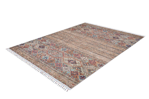 Load image 1 in gallery view. The Tribal Tango - Washable Rug - JR5089 is a rectangular rug with a multicolored geometric pattern in earthy tones, red, blue, and beige accents, plus fringed edges. Shown on a white background; ideal for high-traffic areas.