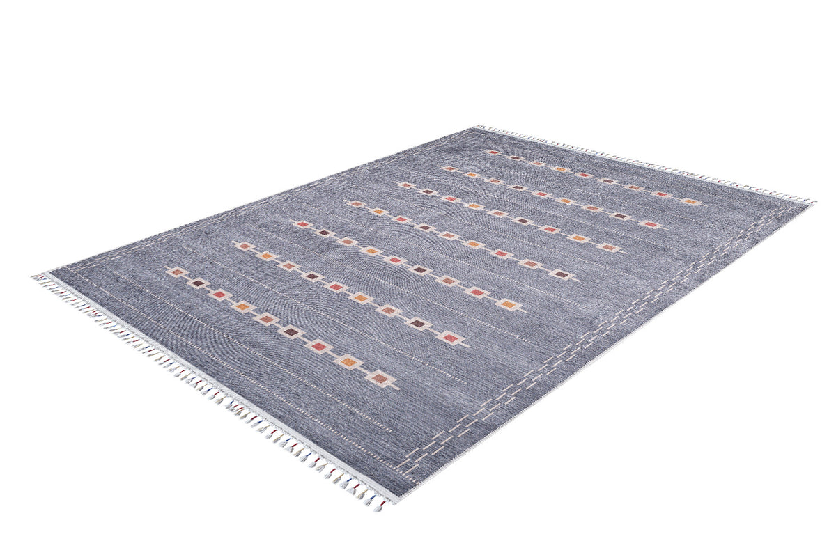 The Tuscan Villa - Washable Rug - JR5058 is a rectangular blue rug with white fringe, rows of colorful square patterns, and subtle white stitched lines—durable, stylish, and perfect for high-traffic areas.