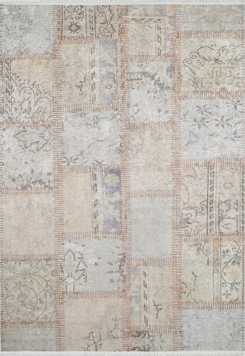 Load image 1 in gallery view. The Urban Utopia - Washable Rug - JR1957 features a patchwork flat weave of rectangular pieces in muted beige, gray, and brown tones, with visible stitching and faded floral and geometric patterns throughout.