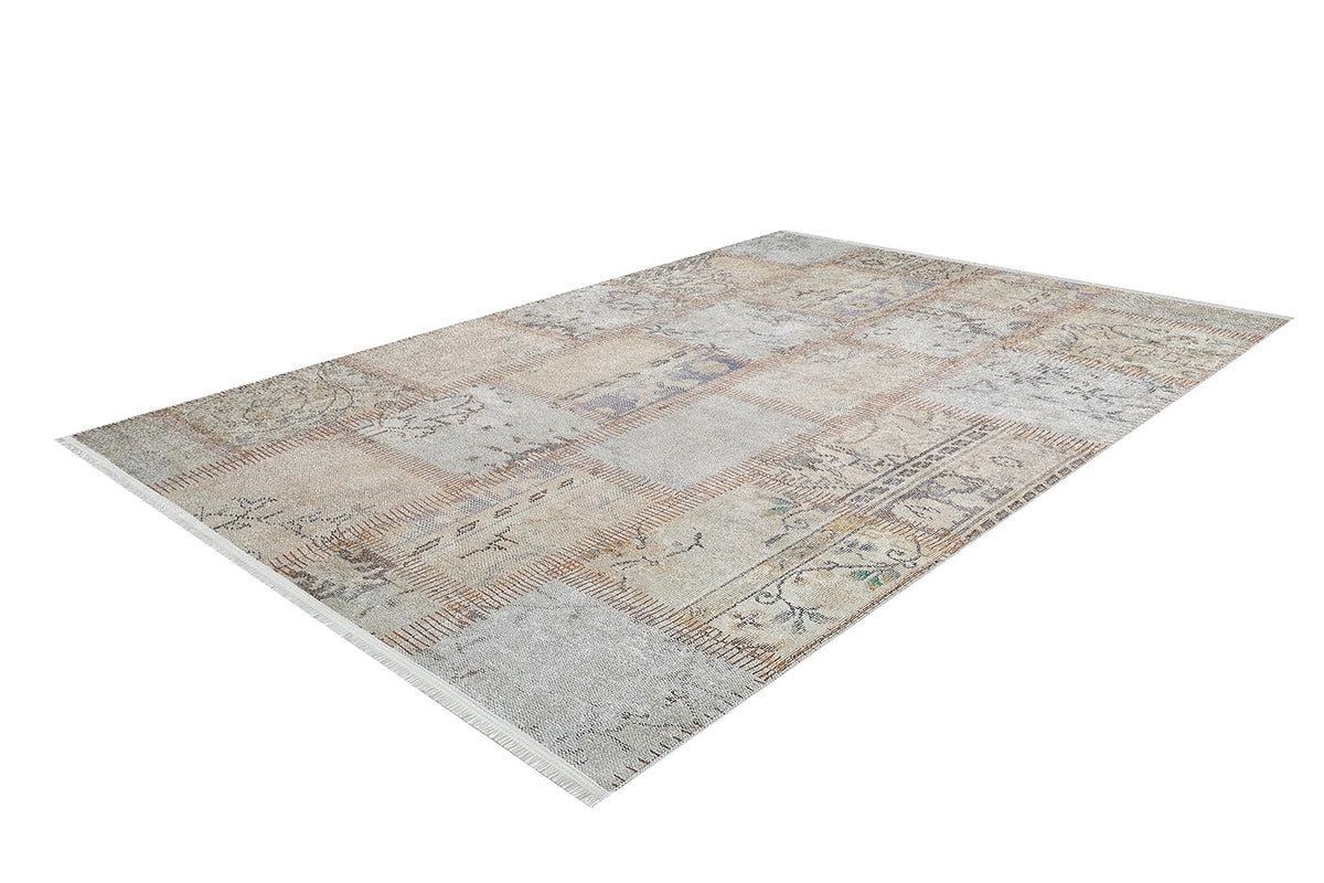 The Urban Utopia - Washable Rug - JR1957 is a rectangular, patchwork-style flat weave rug in muted beige, cream, and light brown tones with subtle patterns and floral designs, showcased on a white background.