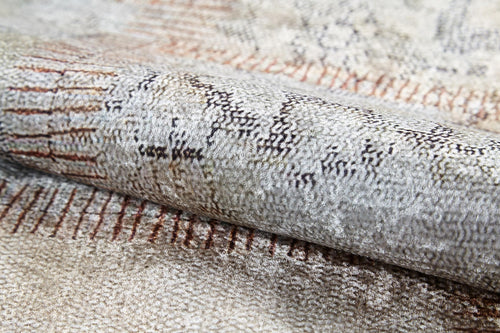 Load image 1 in gallery view. A close-up of the Urban Utopia - Washable Rug - JR1957 reveals a textured flat weave in light beige and gray, with thin, irregular lines—perfect for those seeking stylish cream and beige rugs.