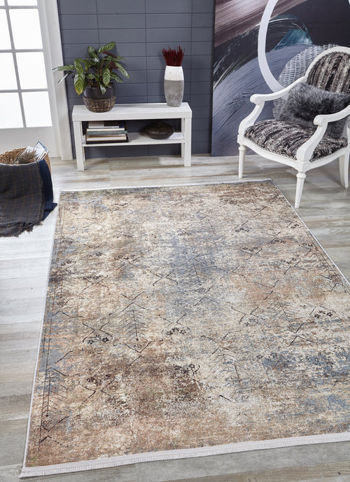 Load image 1 in gallery view. The Windowpane Trellis - Washable Rug - JR1663, featuring a neutral distressed design, rests on light wood floors—ideal for high-traffic areas. Nearby: a white chair with fur cushion, console table with decor, plant, and a basket with blanket.