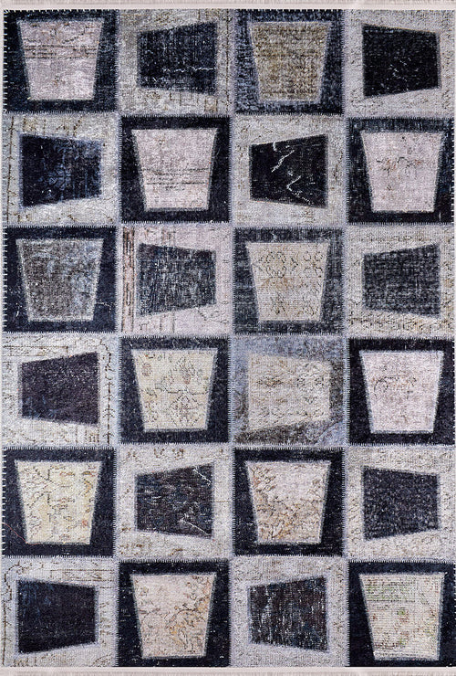 Load image 1 in gallery view. The Windowpane Wonder - Washable Rug - JR184 features a gray-anthracite grid of square blocks with trapezoid and bucket-like shapes in black, gray, and beige for a geometric, abstract look that's easy to care for.
