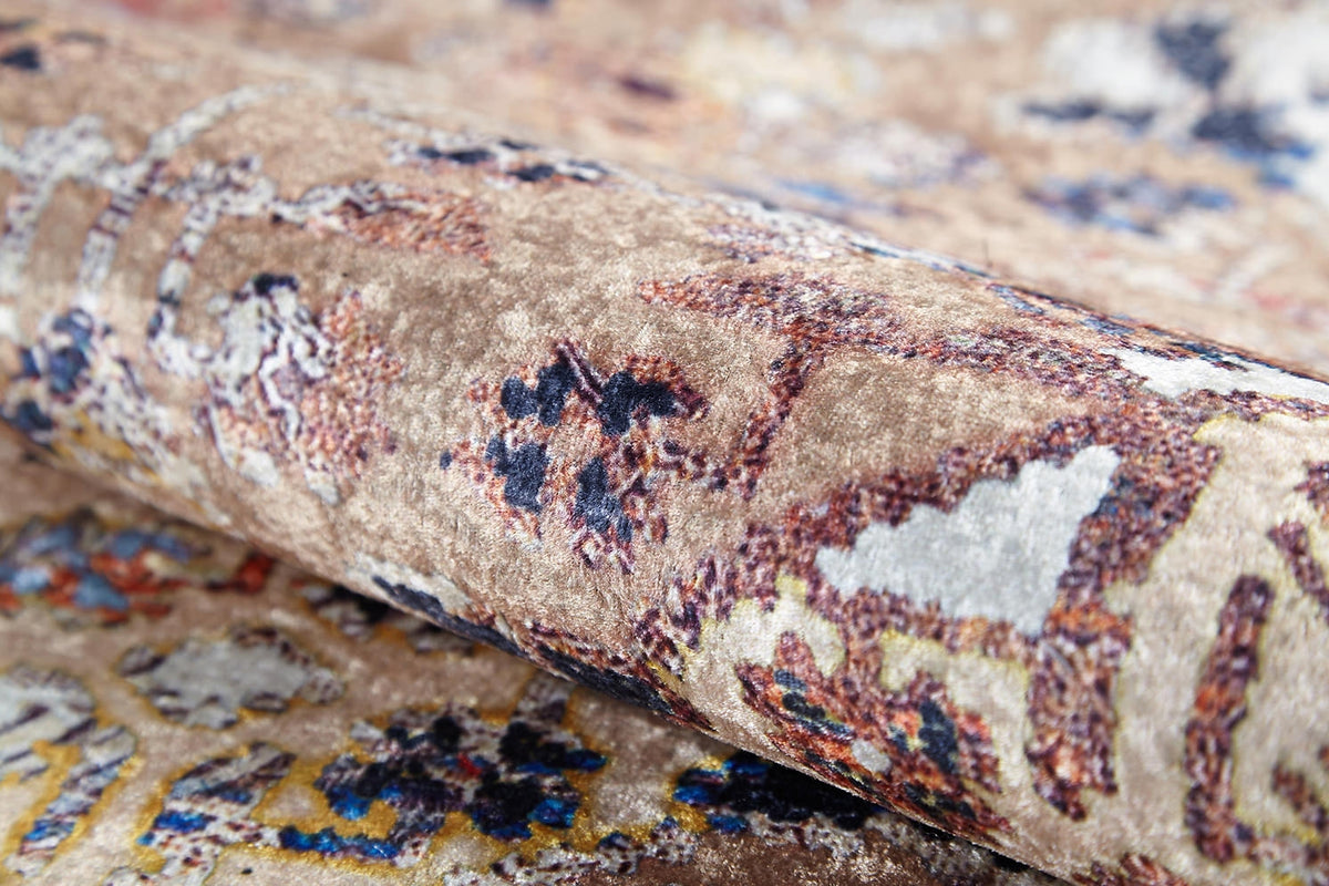 A close-up of the Native Nature's Washable Rug - JR1666 (Outlet) US shows its soft, textured, patterned flat weave in beige, brown, and muted tones with abstract and floral-inspired designs.