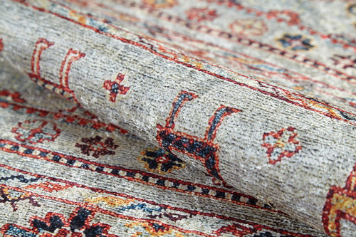 Load image 1 in gallery view. A close-up of the Nomad's Nest - Washable Rug - JR5088 highlights intricate geometric and floral designs in red, yellow, navy, and beige—showcasing its detailed woven texture, perfect for high-traffic areas.